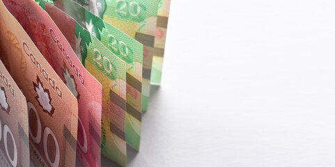 Canadian dollar bills standing up vertically