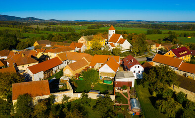 View from drone of old houses of Czech village Cakov in sunny fall day