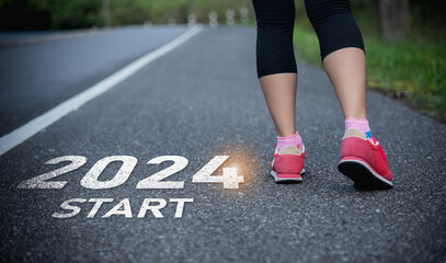 Sport woman runner foot shoe start into the new year 2024. Start up of runner woman running on...