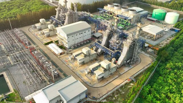 A Combined-Cycle Power Plant blends gas and steam turbines for eco-friendly electricity generation, utilizing waste heat for higher efficiency. Electric power industry. Aerial view drone.
