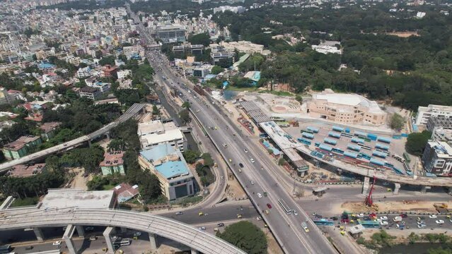 Aerial footage of heavy traffic on Central Silk Board junction, a road junction in Bangalore, India. Located at the Central Silk Board office complex near the BTM Layout at the intersection of Hosur.