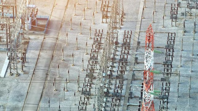 High voltage substations are the backbone of modern electrical infrastructure, enabling seamless electricity delivery for homes, businesses, and industries. Aerial view drone.
