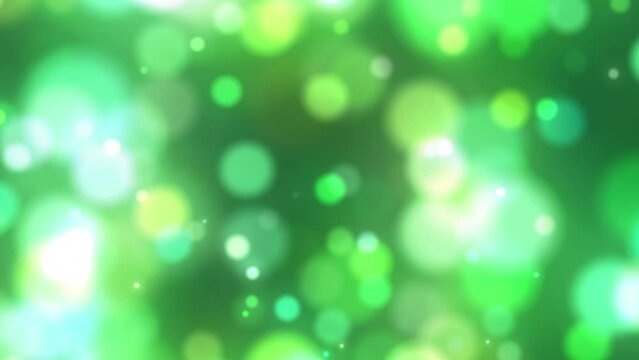 Colorful green yellow bokeh festive animation background. Looping glowing blurry boke backdrops