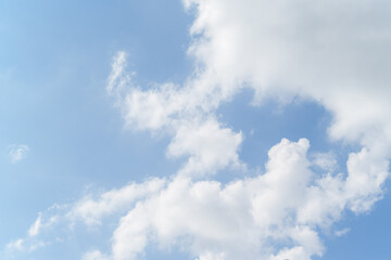 Vibrant colors dance in the sky as sunlight breaks through fluffy clouds.
