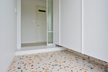 The entrance decorated with terrazzo tiles is a cute interior design