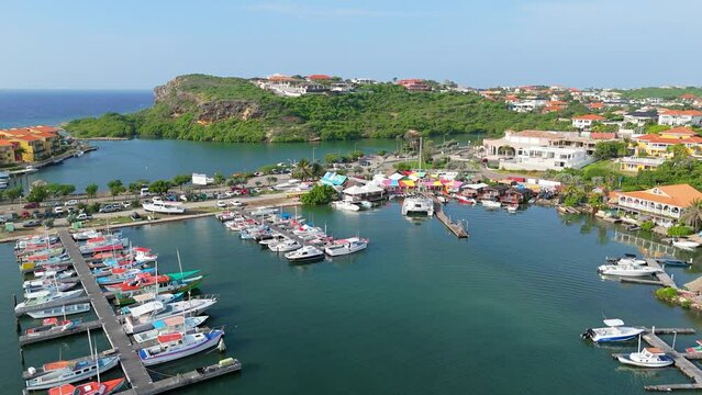 Aerial establishing view of fishing port harbor of Spanish waters Curacao