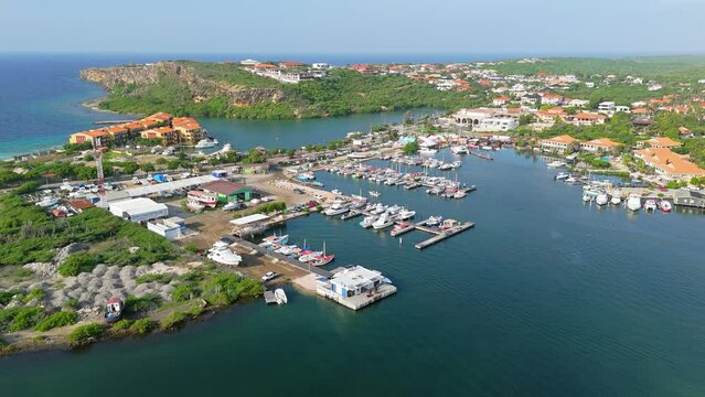 Panoramic aerial establishing view of Spanish Waters fishing port harbor at Curacao