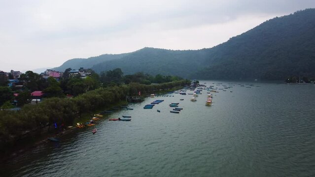 Aerial view of colorful boats on Phewa Lake, a lake in Pokhara, Nepal