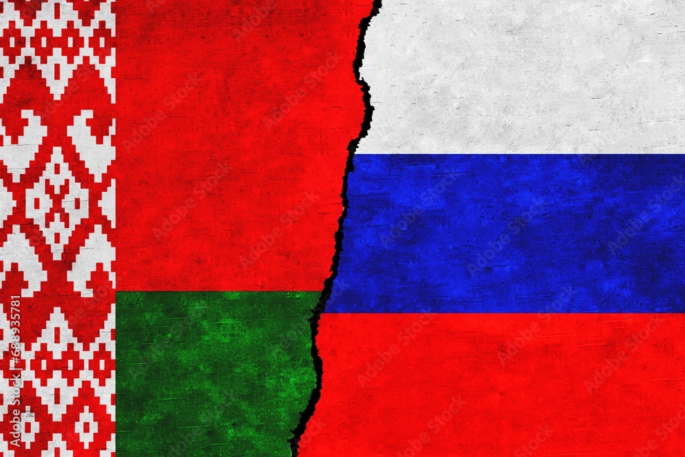 Wall mural russia and belarus painted flags on a wall with a crack. russia and belarus relations. belarus and r