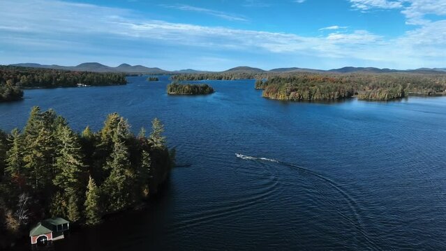 Boat Cruising Across Squam Lake In New Hampshire, United States. aerial