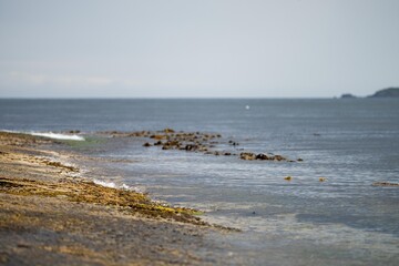 flat rocky coastline by the ocean in tasmania australia