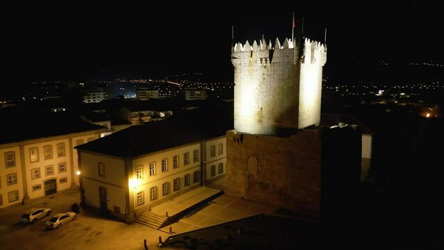 Aerial orbit around castle tower at night in Chaves Vila Real Portugal