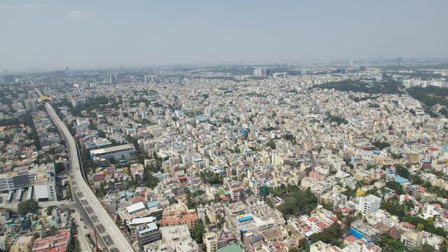 Aerial video showing heavy traffic at Bangalore, India's Central Silk Board intersection. situated at the intersection of Hosur and the Central Silk Board office complex, close to the BTM Layout.