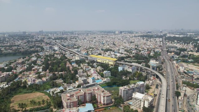Aerial video showing heavy traffic at Bangalore, India's Central Silk Board intersection. situated close to the BTM Layout, where Hosur and the Central Silk Board office complex meet.