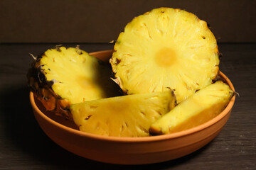 pineapple cut into pieces and served on a plate