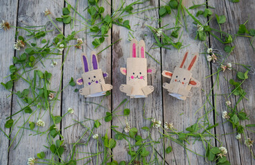Kids craft bunnies out of recycling toilet paper roll, zero waste concept.