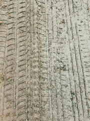 A wheel mark in the dirt. Background