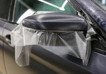 The process of installing PPF on the side mirror. The process of installing PPF on the car. PPF is...