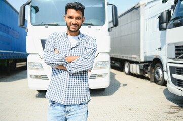 Young Indian truck driver. Concept of road freight transportation.