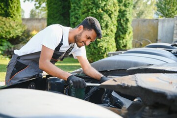 Indian Mechanic repairing the truck