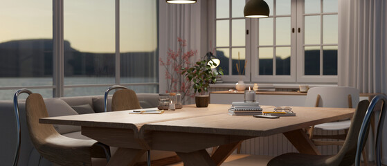 Wooden tabletop with stationery and flower vases in a comfortable living room.