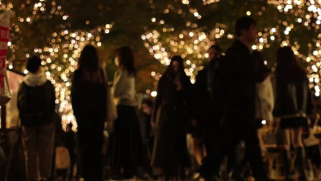 TOKYO, JAPAN - DECEMBER 2023 : View of Christmas illumination light up at Marunouchi area. Japanese winter city and romantic Christmas night concept video. Time lapse shot.