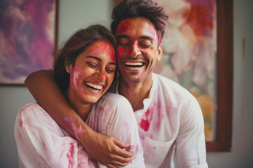 Fototapeta premium Indian ethnic fun loving couple celebrating Holi festival with colours