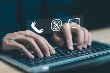 businessman using a laptop to contact customer support shows a contact icon ( address, phone, email, mobile, call ) contact us concept. help from mail websites  digital technology of business service - obrazy, fototapety, plakaty