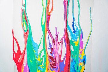 .Sweet tones flowing and blending together on the white floor. .It is a strange abstract picture..fantasy image of dripping paint on white background..colorful of pantone color background. .