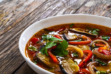 Vegetable soup on wooden table
