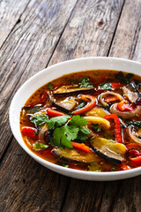 Vegetable soup on wooden table
