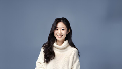 Fototapeta premium Beautiful young woman smiling isolated on studio background. Copyspace area