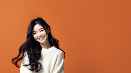 Beautiful young woman smiling isolated on studio background. Copyspace area