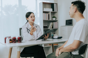 A doctor is counseling a young male patient about prostate cancer and venereal disease, including male sexual dysfunction. Prostate cancer concept