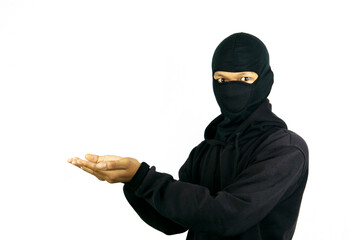 A man wearing a mask and pointing to copy space besides her, isolated on white background