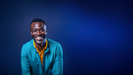 Young man smiling isolated on studio background. Copyspace area