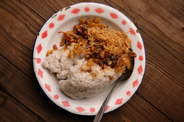 Nasi Campur, Nasi Rames. Rice with side dishes of fried vermicelli, stir-fried tempeh, anchovy sauce and fried peanuts. Indonesian food. Lemak rice.