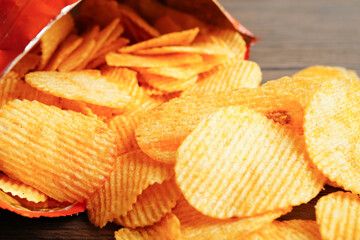 Potato chips in open bag, delicious BBQ seasoning spicy for crips, thin slice deep fried snack fast food.