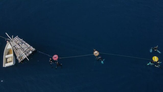 Aerial view of group of people at freedive class, Bali, Indonesia. High quality 4k footage