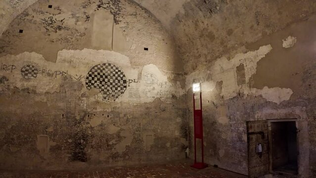 Ferrara, Italy - Dec 3, 2023: dungeons of Ferrara Castle were the contrast between the beauty and the horror of the Renaissance. Captives were locked in narrow and filthy chambers awaiting their fate.