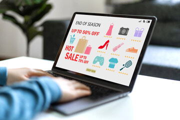 Human use laptop for end of season sale fashion online shopping, shopping time, discount, sale, buy, purchases, digital marketing, ordering product, E-commerce, promotion, online shopping concept