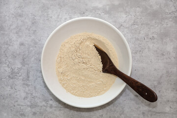 Top view of a white bowl with organic oat fiber normally used for low carb baking.