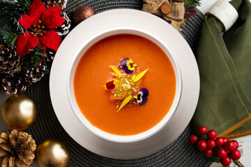 Gazpacho cold tomato soup Typical tapas recipe from the south of Spain. Christmas food served on a table decorated with Christmas motifs.