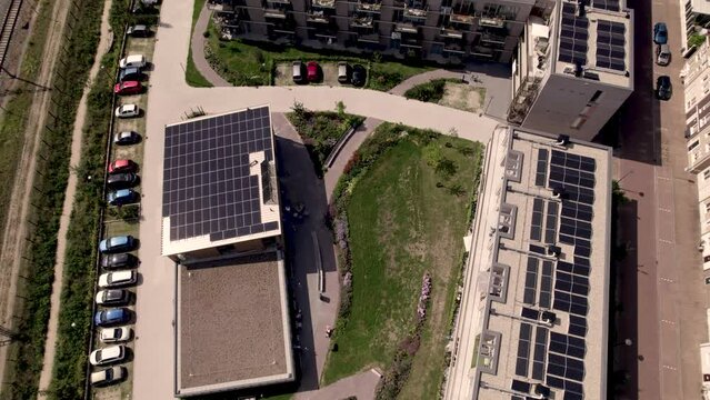 Top down view of rooftops full of solar panels revealing collective building Ubuntuplein project in Zutphen, The Netherlands. Dutch engineering real estate investment urban development