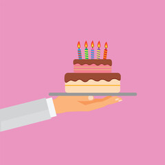 Hand holding a tray with a birthday cake