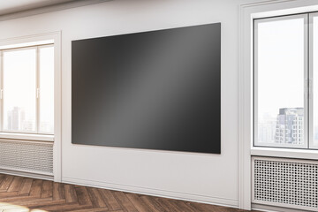 Modern gallery interior with empty black mock up poster on wall, wooden flooring and windows. 3D...