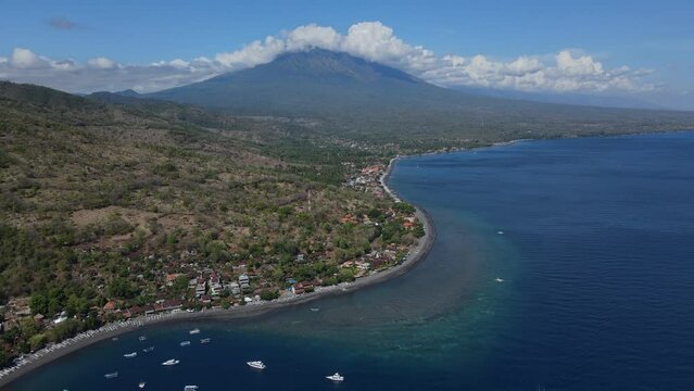 Indonesia, Bali, Amed, Aerial view of Amed beach and volcano Agung. High quality 4k footage
