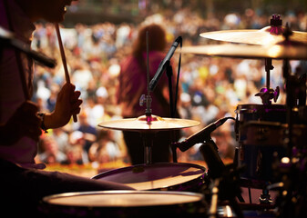 Drums, playing and closeup of hands, concert and music festival in outdoors, talent and audience....