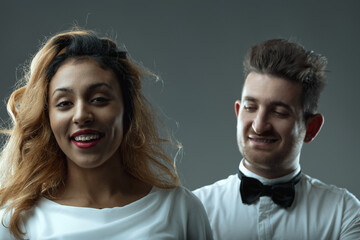 Confident woman with appearently supportive man behind