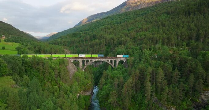 Locomotive transporting goods over Kylling Bridge in Norway. Aerial